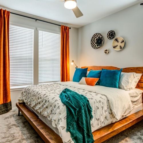 Beautiful bedrooms to fit every need a bedroom with a bed and a fan