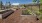 a garden area outside with wooden garden boxes