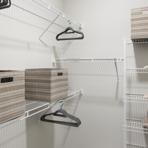 The essence of exceptional living a closet with shelving mounted on the wall